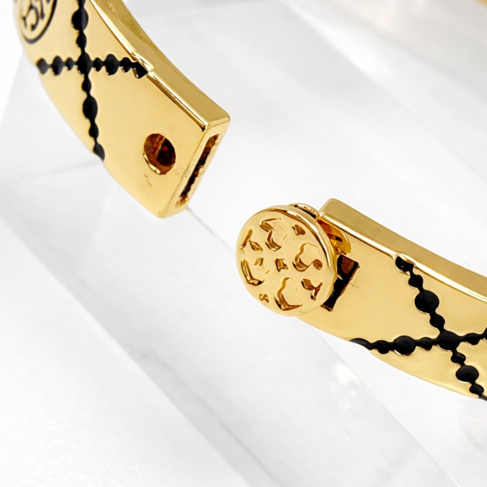 Tory Burch Monogram enamel miller stud hinge bracelet in black and gold tone. - Picture 6 of 7
